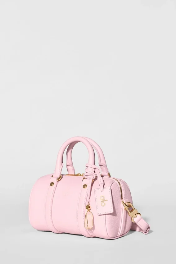Alo Mini Voyage – solfylt rosa skinn