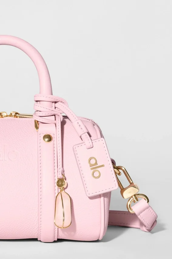 Alo Mini Voyage – solfylt rosa skinn