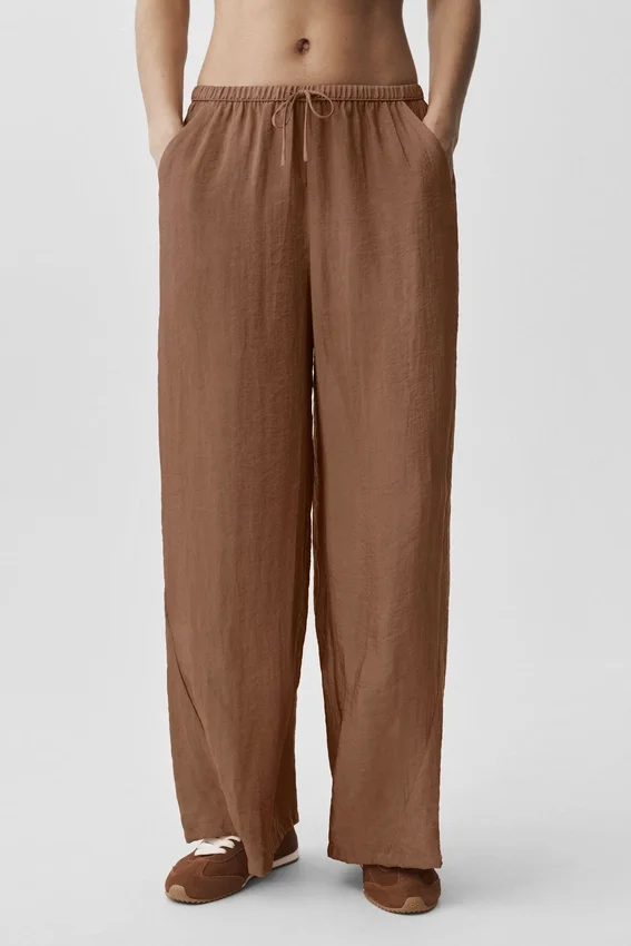 Halvgjennomsiktig Golden Hour-buks med High-Waist og rette ben – solkysset brun