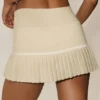 My Serve-tennisskjørt i bomull og kashmir med High-Waist-design – sandbeige/hvit