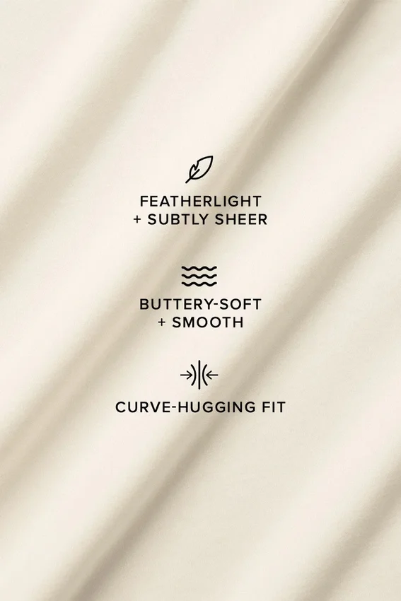 Asymmetrisk Sheer Glow langermet – elfenben