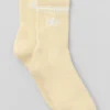 Unisex halvhøye Throwback-sokker – Candlelight Yellow/White
